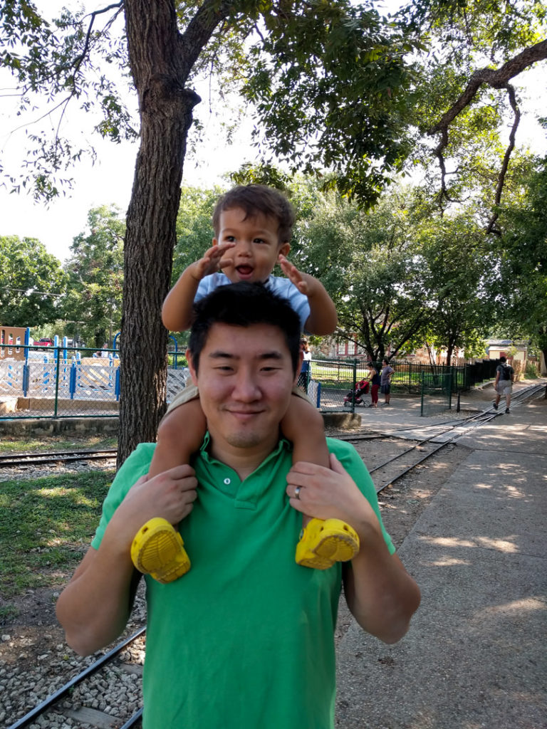 Dad holding toddler on shoulders in Zilker Park - Austin, TX family-friendly itinerary