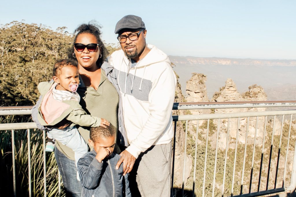 Family in front of Three Sisters Rock in Australia