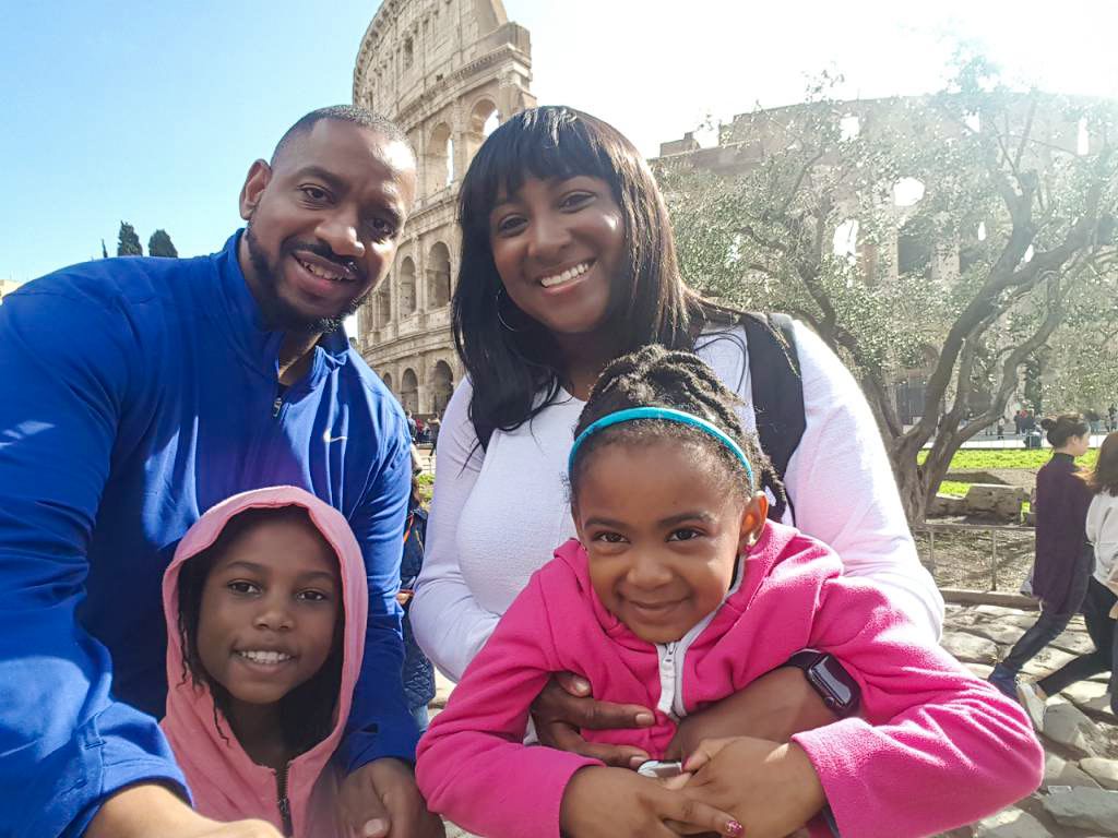 Black family with girls seeing the Colosseum - diversity in family travel