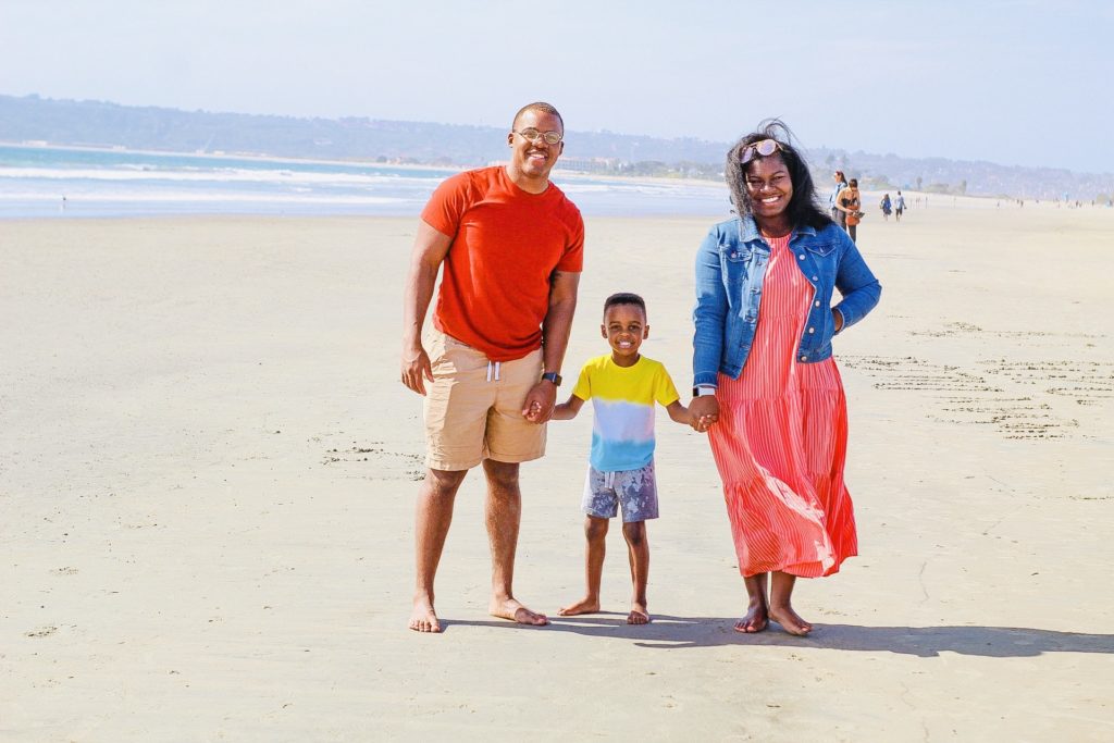 Young Black family on beach in San Diego