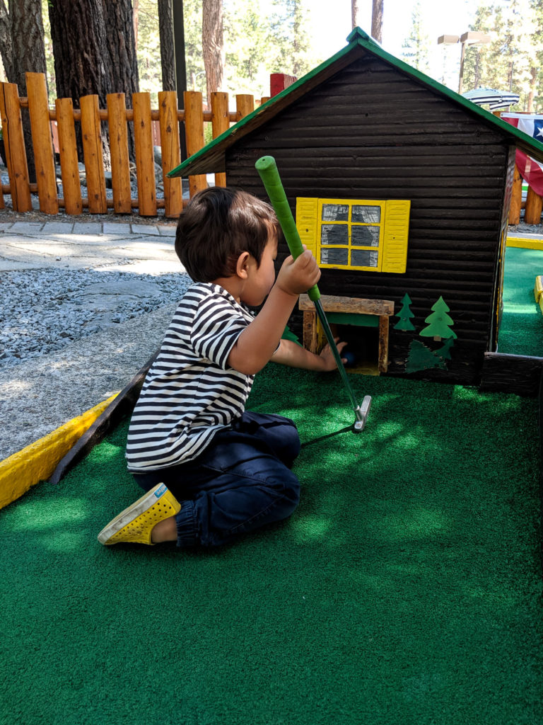 Toddler kneeling mini golf house - Kings Beach