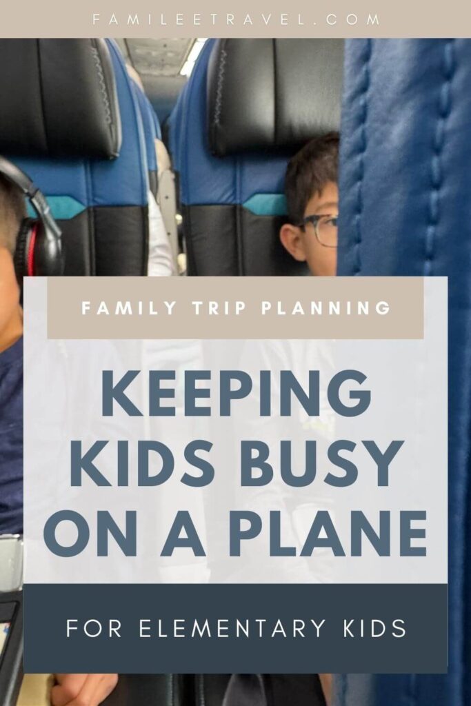 Blog graphic to promote a family travel blog post about things to keep kids busy on an airplane showing a peekaboo view between two airplane seats of two kids, one withe headphones, one with glasses on a plane with large text overlay reading “Keeping Kids Busy on a Plane – For Elementary Kids”
