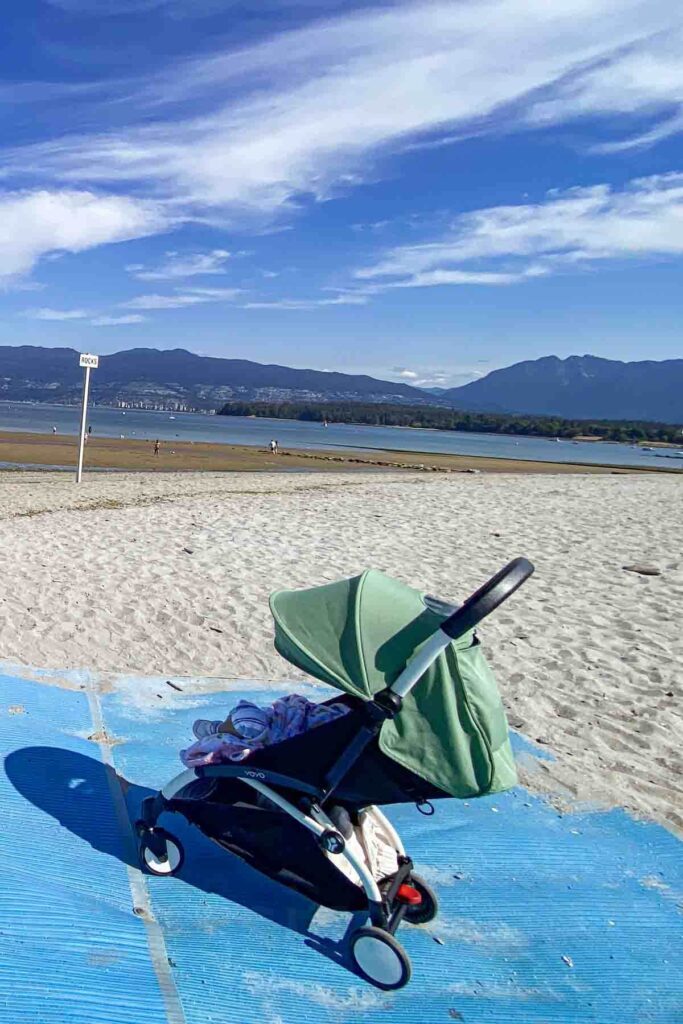 Babyzen Yoyo stroller on a sunny beach path in Vancouver, British Columbia showing how a lightweight stroller lets you still do everything on a family trip.
