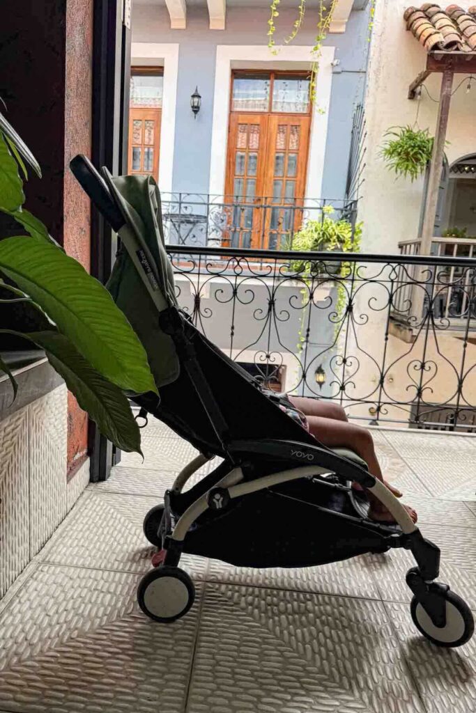 Toddler napping in a Babyzen Yoyo travel stroller in old town Casco Viejo, Panama City apartment, showing how comfortable it is.