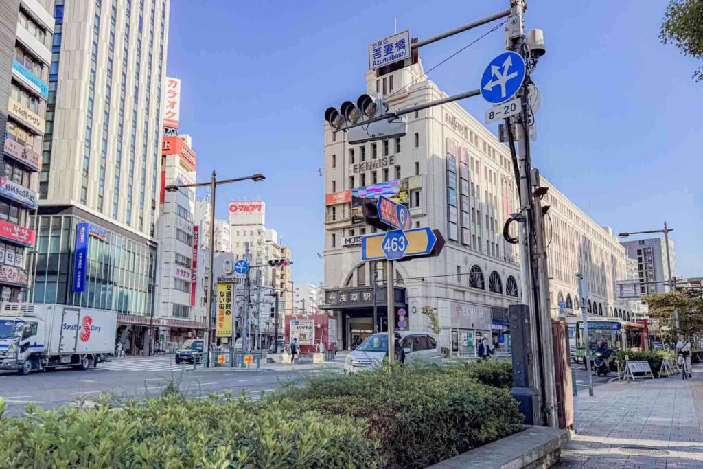Morning street scene near Asakusa Station with wide intersections and tall buildings. This central district is one of the best areas to stay in Tokyo for families with easy access to major transit.