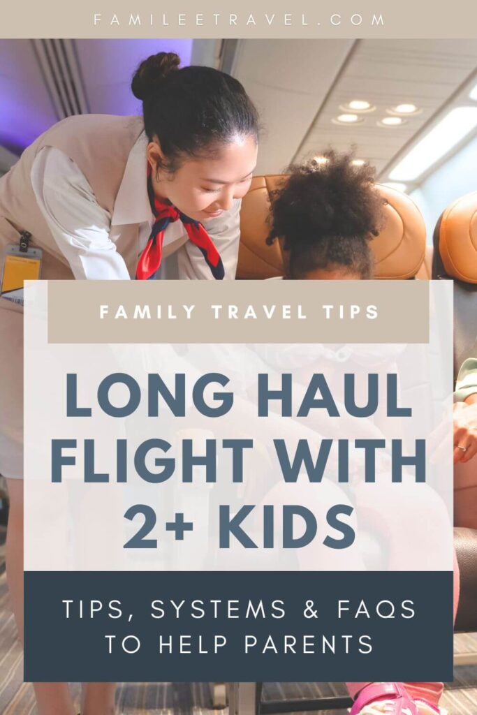 Graphic image meant for Pinterest with a background image partially visible on an airplane with a flight attendant leaning over to help a child with small text overlaid reading "FAMILEETRAVEL.COM" and "FAMILY TRAVEL TIPS". The main title reads "LONG HAUL FLIGHT WITH 2+ KIDS" and "TIPS, SYSTEMS & FAQS TO HELP PARENTS".