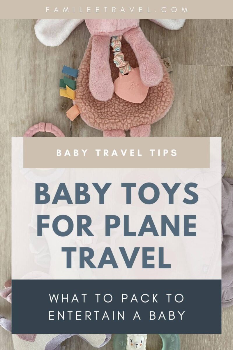 Pinterest style graphic image to promote blog post about baby toys for airplane trips with pink and purple baby sensory and teether toys laid on a wood floor and text overlaid to promote the post "What to Pack to Entertain a Baby" and "Baby Toys for Plane Travel"