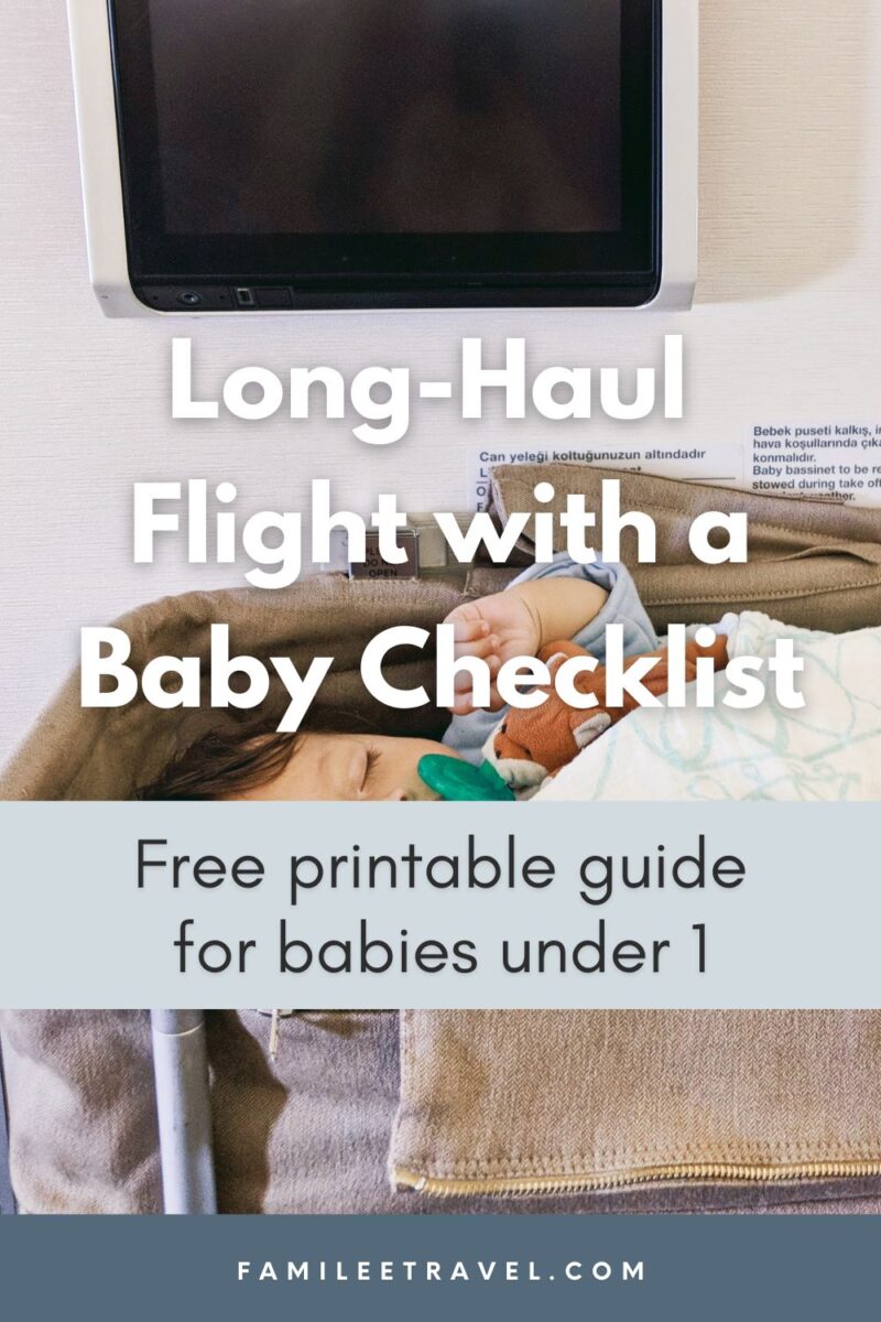 Sleeping baby lying in an airplane bassinet beneath an in-flight entertainment screen with text that reads “Long Haul Flight with a Baby Checklist. Free printable guide for babies under 1.” This Pinterest-style graphic promotes a practical long haul flight with a baby checklist for parents preparing for international travel.