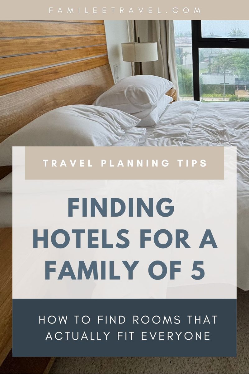 A rumpled white hotel bed sits beside a large window behind a beige and blue travel planning graphic. The graphic reads "FAMILEETRAVEL.COM. TRAVEL PLANNING TIPS. FINDING HOTELS FOR A FAMILY OF 5. HOW TO FIND ROOMS THAT ACTUALLY FIT EVERYONE."